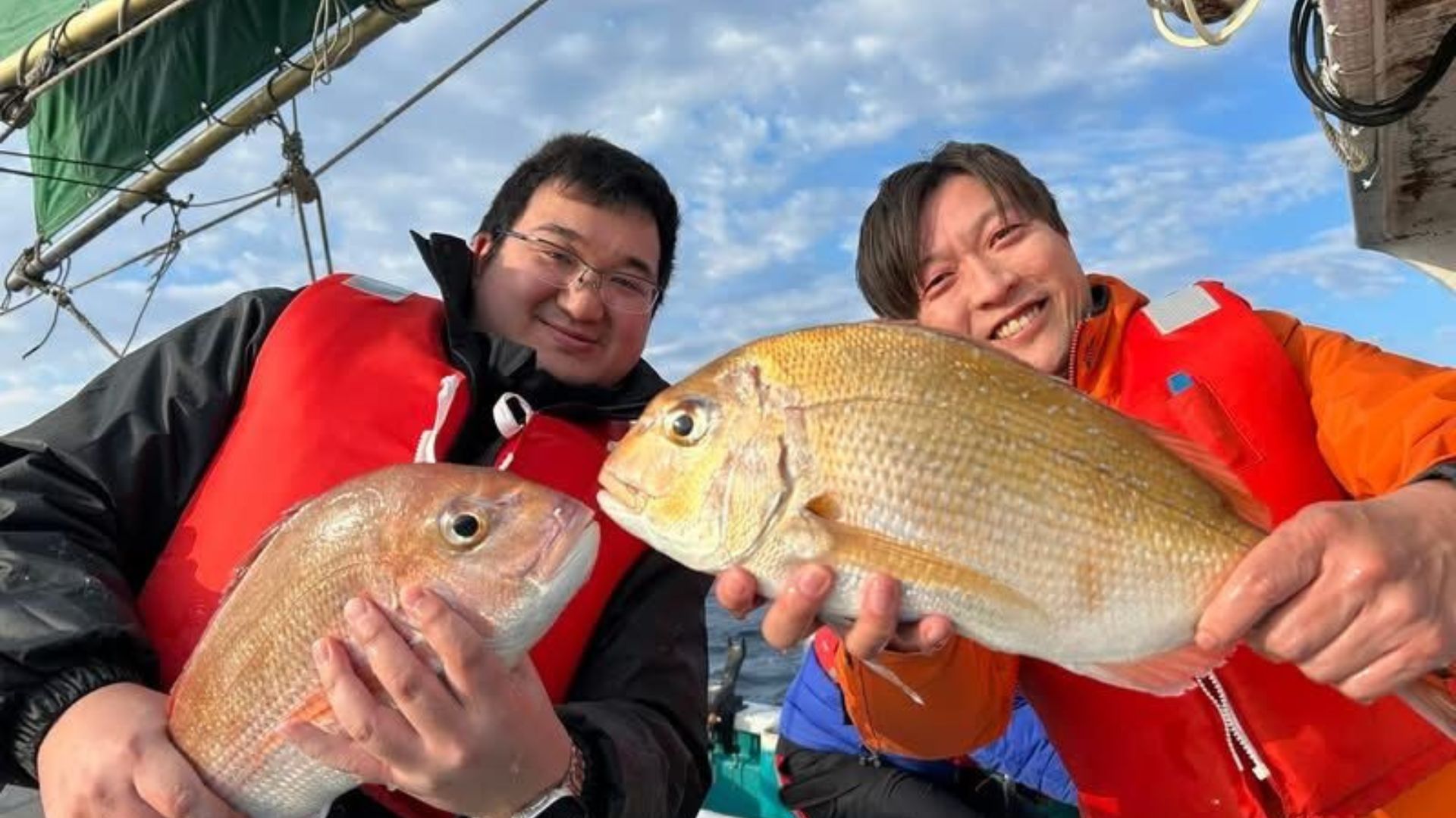 Reeling in a fish aboard Kaijinmaru