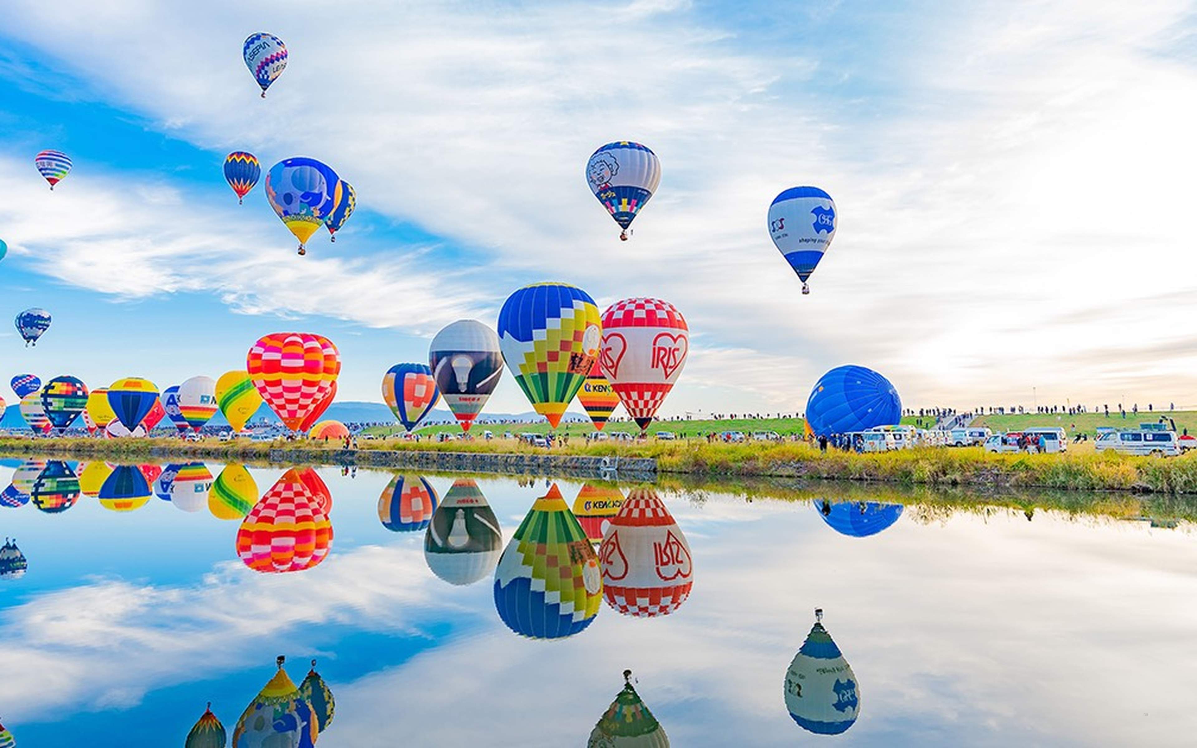 Hot-air balloons reflected in the river at the Saga International Balloon Fiesta