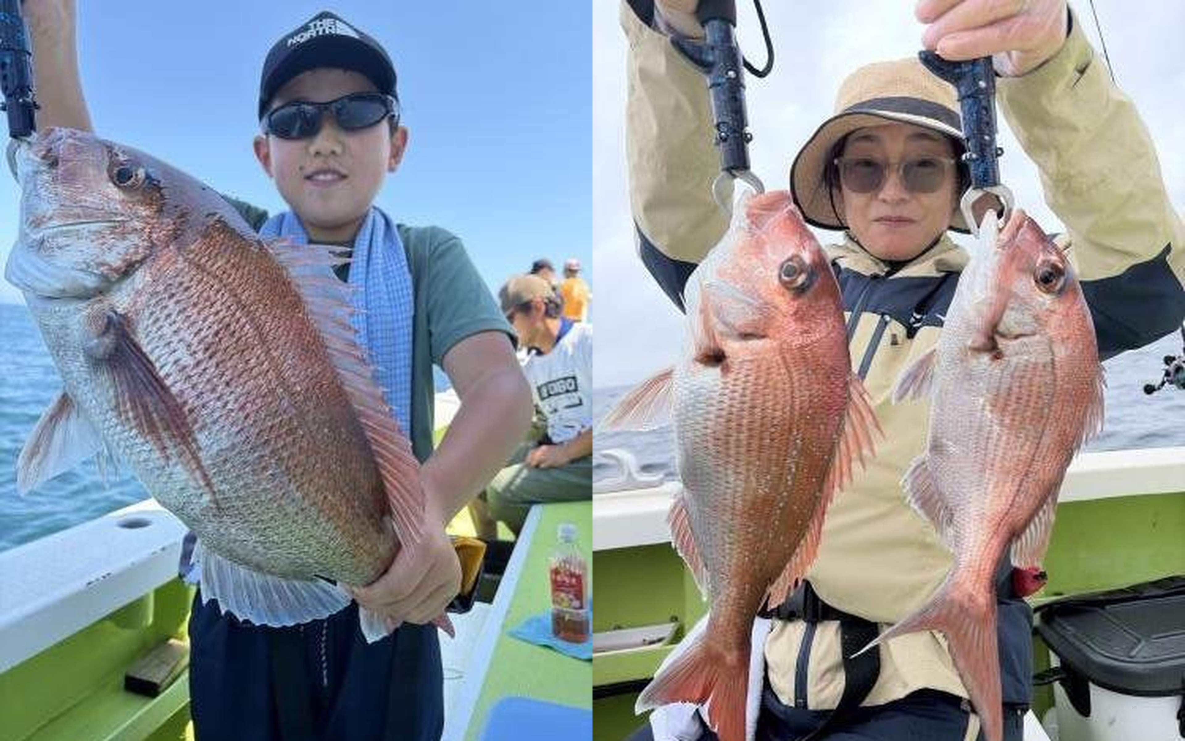 A boy holding a big red fish, and a woman in a hat holding a red fish in each hand