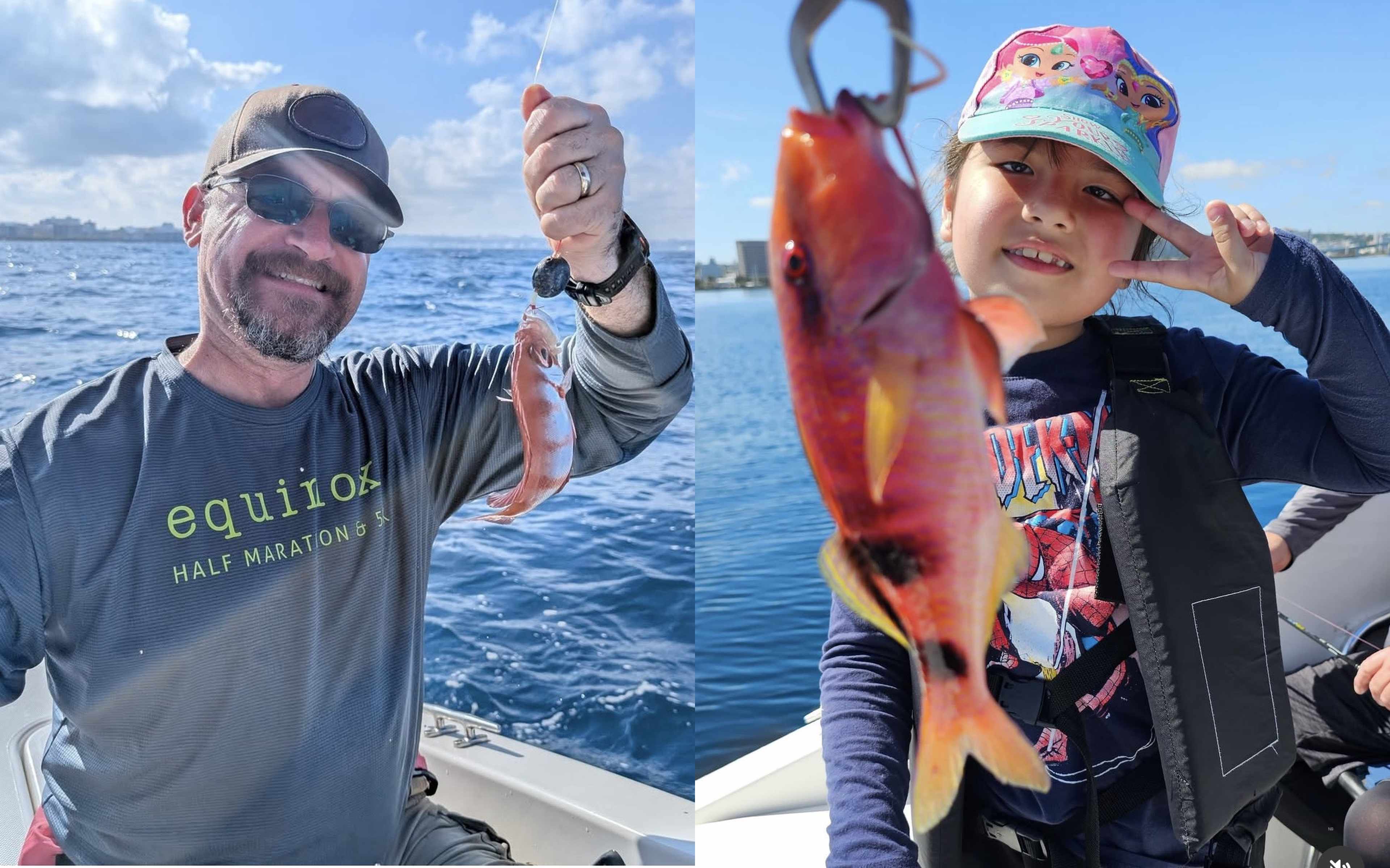 A man holding a small red fish, and a girl making a peace sign beside a red fish